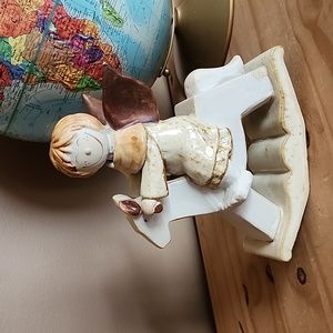 Ceramic angel on rocking  horse figurine